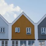 white and brown concrete house under blue sky during daytime